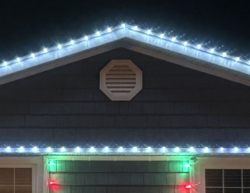 Cool white lights on a roof peak