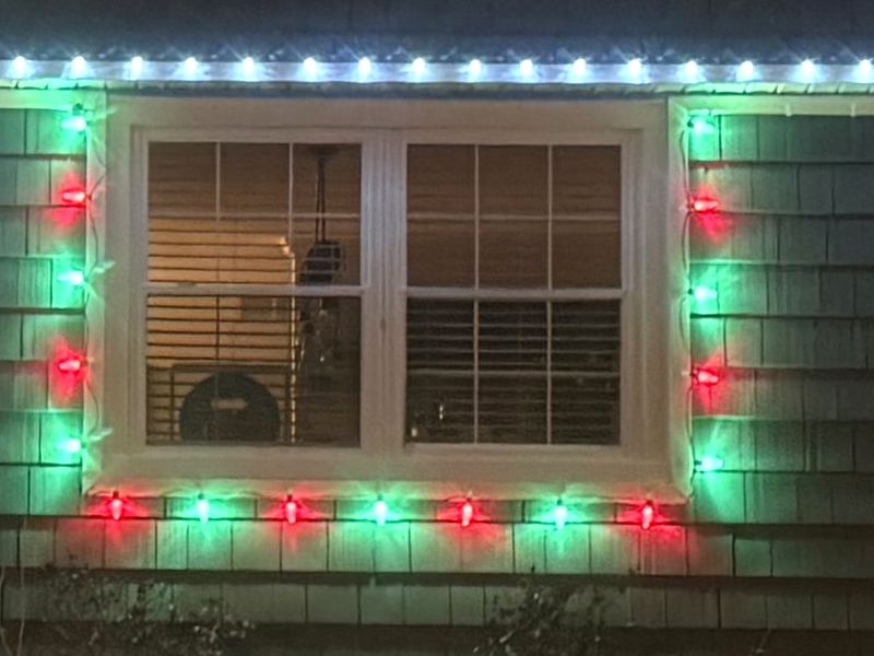 Red and green lights framing a window