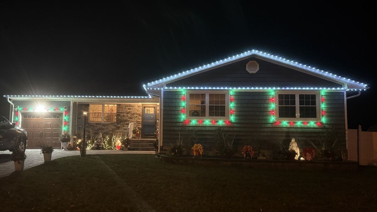Ranch home with a cool white roofline and red and green windows